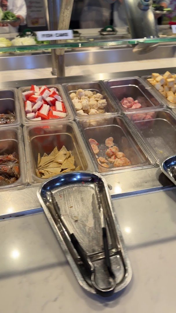 Salad bar and seating in a casual dining room